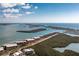 Aerial view of a condominium complex nestled among islands, boasting waterfront views at 1651 Beach Rd # 301, Englewood, FL 34223