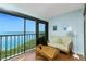 Cozy balcony with sliding glass door offering water views, perfect for relaxation at 1651 Beach Rd # 301, Englewood, FL 34223