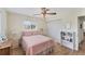 This bedroom boasts ample natural light, hardwood floors, and a closet at 1710 Loralin Dr, Englewood, FL 34223