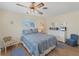 Comfortable main bedroom includes a bed, dresser, and hardwood floor at 1710 Loralin Dr, Englewood, FL 34223