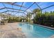 Sparkling pool with screened enclosure, patio, and lounge chairs, perfect for relaxation and entertaining at 17728 Silverspur Dr, Punta Gorda, FL 33982