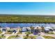 Scenic view of waterfront homes, complete with boat docks, tropical landscaping and stunning water access at 18502 Arapahoe Cir, Port Charlotte, FL 33948