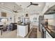 This kitchen flows into the living area and features stainless appliances, a center island, and modern finishes at 18502 Arapahoe Cir, Port Charlotte, FL 33948