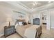 Serene bedroom with a tray ceiling, recessed lighting, and neutral decor, creating a relaxing atmosphere at 18502 Arapahoe Cir, Port Charlotte, FL 33948