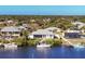 A waterfront home with a private dock and sailboat along a canal community at 18502 Arapahoe Cir, Port Charlotte, FL 33948