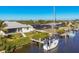 Waterfront home with a private dock and sailboat, and a screened in lanai with pool at 18502 Arapahoe Cir, Port Charlotte, FL 33948