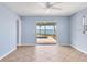 Brightly lit bedroom with access to the backyard pool and amazing water views at 1906 Mississippi Ave, Englewood, FL 34224