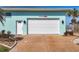 Exterior view of the garage and front entry showcasing the well-maintained yard at 1906 Mississippi Ave, Englewood, FL 34224