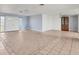 Large living space with tile flooring and seamless transition into dining area with a cabinet at 1906 Mississippi Ave, Englewood, FL 34224