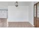 View of the well-lit living room showcasing bright paint, clean tile floors, and modern fixtures at 1906 Mississippi Ave, Englewood, FL 34224