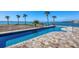 Enjoy the amazing waterfront views from your beautiful pool with surrounding brick pavers at 1906 Mississippi Ave, Englewood, FL 34224