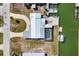 Aerial view of home with a pool, canal access, boat lift, and dock at 1922 Michigan Ave, Englewood, FL 34224