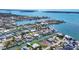 Expansive aerial view of waterfront community with private docks, providing direct access to beautiful bay waters at 1922 Michigan Ave, Englewood, FL 34224