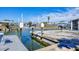 Dock featuring boat lift and canal access and views of other homes at 1922 Michigan Ave, Englewood, FL 34224