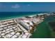 Breathtaking aerial view showcasing the beachfront property outlined in red with ocean and intercoastal access at 2255 N Beach Rd # 12, Englewood, FL 34223