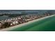 Expansive coastal aerial view highlighting beachfront property outlined in red with ocean access at 2255 N Beach Rd # 12, Englewood, FL 34223