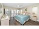 Bright bedroom features a large sliding glass door to the outside at 2255 N Beach Rd # 12, Englewood, FL 34223