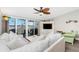 Bright living room with a ceiling fan and a view of the lanai at 2255 N Beach Rd # 12, Englewood, FL 34223