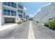 Exterior shot showcasing white condos along a well-maintained street with landscaping at 2255 N Beach Rd # 12, Englewood, FL 34223