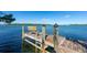 Wooden dock with bench and ladder, ideal for swimming and relaxing at 2375 N Beach Rd # 2B, Englewood, FL 34223