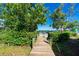 Wooden walkway leads to a private dock with water access at 2375 N Beach Rd # 2B, Englewood, FL 34223