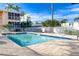 Community pool with surrounding patio and balcony views at 2375 N Beach Rd # 2B, Englewood, FL 34223