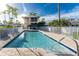 Community pool with surrounding patio and balcony views at 2375 N Beach Rd # 2B, Englewood, FL 34223