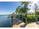 Wooden deck with bench and access to the waterfront at 2375 N Beach Rd # 2B, Englewood, FL 34223