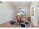 Bright dining area with a chandelier, rug and large window letting in natural light at 2657 Tusket Ave, North Port, FL 34286