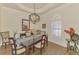 Dining room featuring modern lighting fixture and natural light from shuttered window at 2660 Sable Palm Way, Port Charlotte, FL 33953