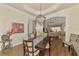 Dining room featuring hardwood floors and modern lighting with views into the living room at 2660 Sable Palm Way, Port Charlotte, FL 33953