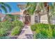 Inviting front entrance featuring a brick walkway and lush landscaping at 2660 Sable Palm Way, Port Charlotte, FL 33953