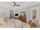 Airy main bedroom boasts a tray ceiling, wooden furniture, and a cozy sitting area at 2660 Sable Palm Way, Port Charlotte, FL 33953