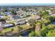 Community aerial shot showcasing homes nestled amongst the lush greenery and waterways at 3204 Depew Ave, Port Charlotte, FL 33952