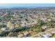 Aerial view of a coastal residential community with waterfront homes and lush greenery at 3204 Depew Ave, Port Charlotte, FL 33952