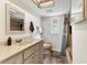 Bathroom featuring a single sink vanity, tile floors, a shower/bathtub and a neutral color scheme at 3204 Depew Ave, Port Charlotte, FL 33952