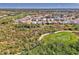 Beautiful aerial shot of tiled roof homes near a golf course and pond in a lush green neighborhood at 3307 Osprey Ln, Port Charlotte, FL 33953