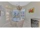 Cozy breakfast nook with a glass table and shuttered windows, perfect for morning coffee at 3307 Osprey Ln, Port Charlotte, FL 33953