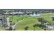 Golf course and clubhouse aerial view at 404 Cerromar N Cir # 112, Venice, FL 34293