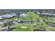 Golf course and clubhouse aerial view at 404 Cerromar N Cir # 112, Venice, FL 34293