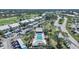 Aerial view of condo community pool and surrounding buildings at 404 Cerromar N Cir # 112, Venice, FL 34293