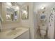 Updated bathroom with beige vanity, shower, and toilet at 404 Cerromar N Cir # 112, Venice, FL 34293