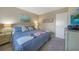 King-size bed in bright and airy bedroom at 404 Cerromar N Cir # 112, Venice, FL 34293