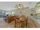 Dining area with wooden table and chairs, near living room at 404 Cerromar N Cir # 112, Venice, FL 34293