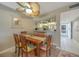 Bright dining room with wood table and seating for six at 404 Cerromar N Cir # 112, Venice, FL 34293