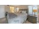 Spacious bedroom with king-size bed, ample closet space, and ensuite bath at 404 Cerromar N Cir # 112, Venice, FL 34293