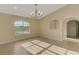 Bright living room featuring tile flooring, large window, and neutral paint at 43 Blue Hen Dr, Placida, FL 33946