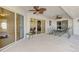 Screened-in patio with a ceiling fan overlooking the water at 43 Blue Hen Dr, Placida, FL 33946