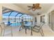 Screened-in patio with a pool overlooking the water at 43 Blue Hen Dr, Placida, FL 33946