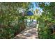 Wooden dock leads to the calm waters at 5 Pointe Way, Placida, FL 33946